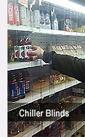 Man pushing trolley through a PVC strip curtain